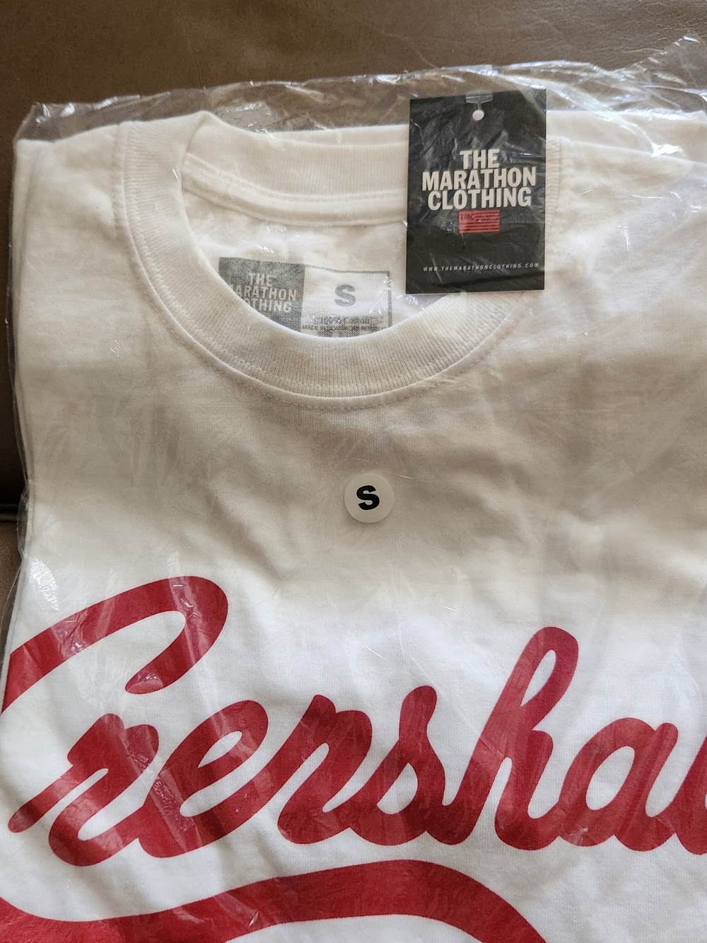 The Marathon Clothing White Short Sleeve Tee with Red Script Graphic